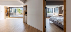 Cải tạo hai căn hộ thành không gian thông tầng 310m² ngập nắng tại Sài Gòn