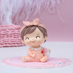 Tượng em bé GÁÍ cài nơ hồng (sứ).