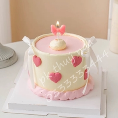 Vỉ 5 cây nến hình nơ màu hồng.