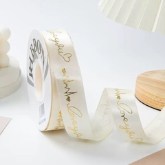 Ruybang lụa 2.5cm x 35m chữ love you gắn trái tim nhũ vàng - màu KEM.
