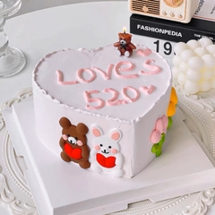Tượng đôi gấu thỏ ôm trái tim nhựa dẻo.