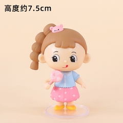 Em bé gái tóc NÂU cầm kẹo (sứ).