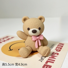 Tượng gấu nâu nhạt-cài nơ màu hồng.