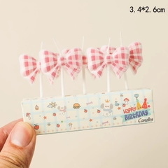 Vỉ 5 cây nến hình nơ -CARO HỒNG.