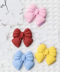 Set 10 nơ nhựa dẻo mix màu kt3.1cm x 3.5cm.