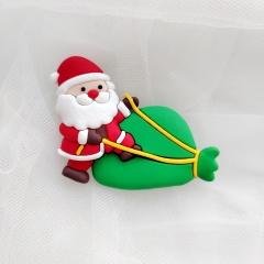 Tượng nhựa dẻo-Ông già noel kéo túi quà to màu xanh.