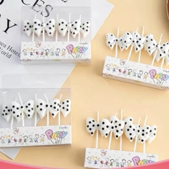 Vỉ 5 cây nến hình nơ -MÀU TRẮNG CHẤM BI ĐEN.