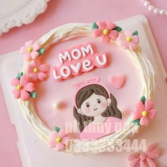 Tượng nhựa dẻo - Mẹ áo hồng, tóc cài nơ hồng.