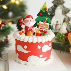 Tượng nhựa - ông già noel và túi quà màu vàng.