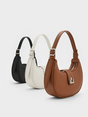 Trice Metallic Accent Belted Curved Shoulder Bag