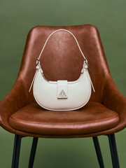 Trice Metallic Accent Belted Curved Shoulder Bag