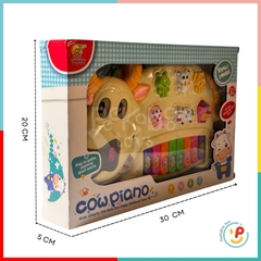 Đồ chơi đàn piano hình bò sữa có đèn và âm thanh tiếng kêu động vật 6600
