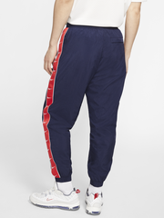 Quần Dài NK Taped Swoosh Popover Pants