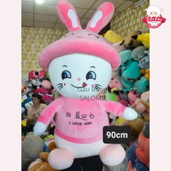 Gấu Bông Mèo Ngồi Mắt Liếc Đội Mũ Thỏ Khổng Lồ Dễ Thương SALOME Thú Bông Mèo Hồng Liếm Mép Ôm Ngủ