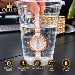 ĐỒNG HỒ NỮ OLIUS 28MM VÀNG HỒNG MẶT TRẮNG – DÂY GỐM SỨ – ĐÍNH ĐÁ PHA LÊ – MÁY QUARTZ