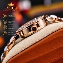 ĐỒNG HỒ NỮ OLIUS 28MM VÀNG HỒNG MẶT TRẮNG – DÂY GỐM SỨ – ĐÍNH ĐÁ PHA LÊ – MÁY QUARTZ