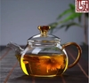 Ấm thủy tinh quai vàng dáng tròn