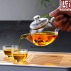 Ấm thủy tinh quai vàng dáng tròn