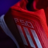 giay-bong-da-adidas-f50-elite-laceless-do-vach-trang-khong-day-tf