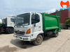 Xe ép rác Hino FC9JETC 8 khối cabin trắng thùng cuốn ép màu xanh, nhìn góc ba phần tư phía trước