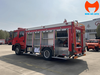 Khoang thiết bị mở trên xe chữa cháy bột khô HOWO 7 khối, thấy giá đỡ thiết bị và cửa cuốn nhôm