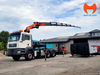 Đầu kéo MAN gắn cẩu Palfinger PK 29002 đang triển khai chân chống