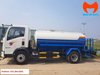 Xe bồn nước HOWO nhìn ngang với cabin trắng và bồn xanh trắng