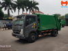 Xe cuốn ép rác VEAM VT652 cabin xám, thùng xanh nhìn từ phía trước bên trái