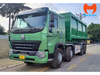 Xe Howo cabin xanh và thùng rác rời nhìn từ góc trước