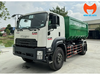 Xe Isuzu cabin trắng và thùng rác rời xanh nhìn chéo phía trước