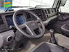 Cabin xe ép rác Alpha 19 nhìn từ ghế phụ, vô lăng có logo Volkswagen, đồng hồ hiển thị và cần số sàn
