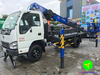 Xe thang nâng người Dasan 18 m nhìn góc 3/4 trên nền Isuzu
