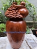 Tượng di lặc ngự chum vàng gỗ hương Kbang