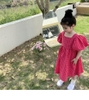 Đầm caro hồng cánh sen cột dây lưng