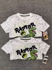 Áo thun bé trai khủng long Raptor màu trắng vảy sơn