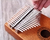dan-kalimba-17-phim-ka04-go-nguyen-khoi-full-phu-kien-am-thanh-trong-treo