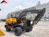 may-xuc-dao-banh-lop-0-3m3-trung-quoc-gia-re