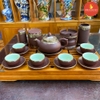 Bộ ấm chén gốm nâu bọc đồng