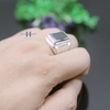 nhan-bac-nam-duy-hien-phong-thuy-da-den-hinh-chu-nhat-dai-duc-tron-dinh-da-2-5-l