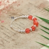 vong-tay-tre-em-charm-cau-bac-va-cau-nhua-mau-do-v2409110019