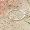 vong-tay-be-gai-charm-hoa-4-canh-hong-ket-hop-charm-xoan-oc-2-ben-v2409110028