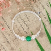 vong-tay-tre-em-charm-ca-va-cau-bac-ket-hop-charm-cau-xanh-v2409110021