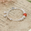 vong-tay-tre-em-charm-cau-bac-va-da-do-co-chuong-v2409110025