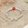 vong-tay-tre-em-charm-cau-bac-va-da-do-co-chuong-v2409110025