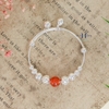 vong-tay-tre-em-charm-cau-bac-va-da-do-co-chuong-v2409110025