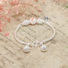 vong-tay-tre-em-charm-cau-bac-va-da-co-chuong-v2409110022