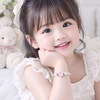 vong-tay-tre-em-hoa-tiet-gan-charm-hoa-6-canh-hong-v2409110011