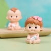 Tượng sứ -bé GÁI ôm bình sữa.