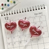 Vỉ nến 3 trái tim đỏ có chữ love you.