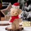 Gấu bông màu nâu gồm cả mũ và khăn (kt 7x 16cm).